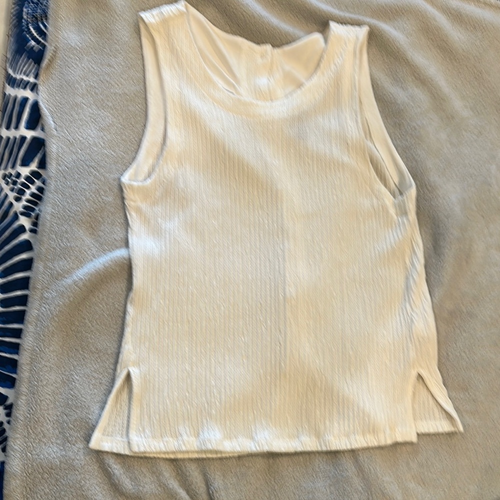 Anthropologie cream sleeveless top with button back